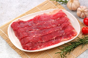 Fototapeta premium Fresh thinly sliced ​​raw beef or Shortplate 