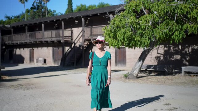 Senior woman enjoys a morning walk through Casa Grande in Sonoma, California while learning about the history of General Vallejo.