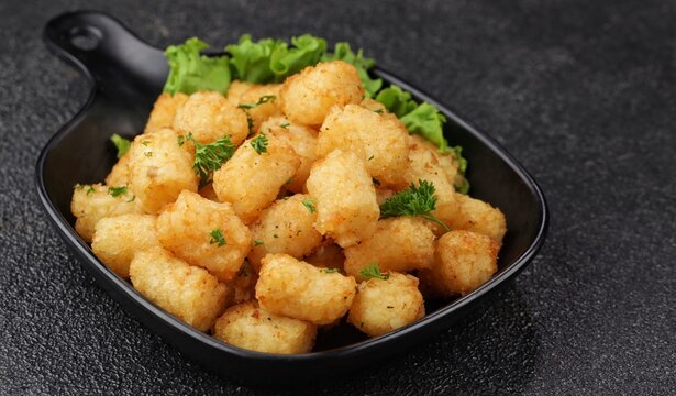 Delicious fried potatoes known as tater tots or pom pom potato