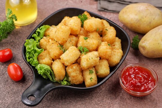 Delicious fried potatoes known as tater tots or pom pom potato