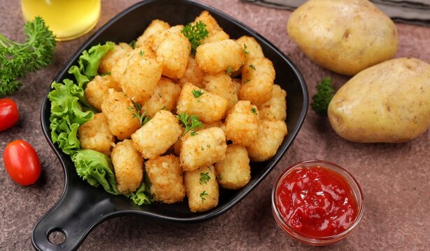 Delicious fried potatoes known as tater tots or pom pom potato