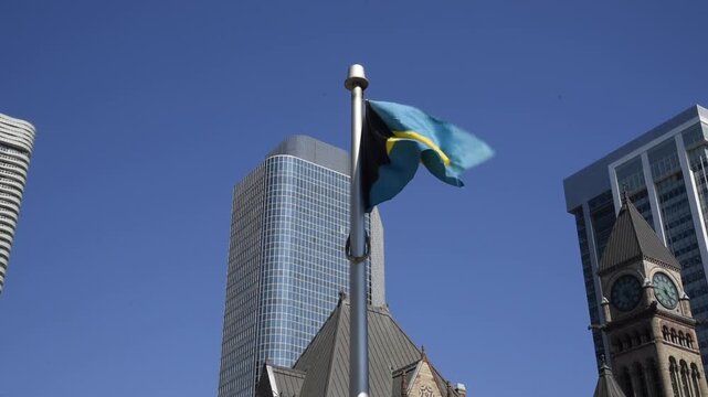 The Bahamian flag on a flagpole at Toronto City Hall&rsquo;s Nathan Phillips Square.