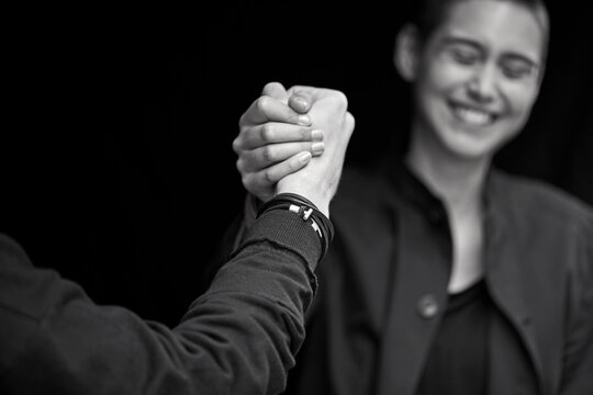 Young couple shaking hands