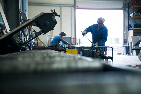 Metal construction, metal worker grading steel