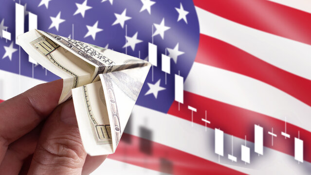 Financial investment. Dollar banknote folded into a paper airplane symbolizes capital flow, stock market volatility, currency trading and the United States economy.