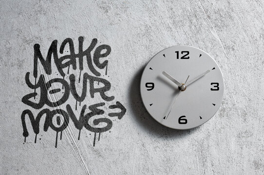 Make your move graffiti message on concrete wall with clock