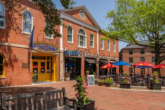 Newburyport, MA, US-June 23, 2025: Street scene in historic downtown of this small town with its quaint streets with 19th century brick buildings and trendy shops and restaurants.