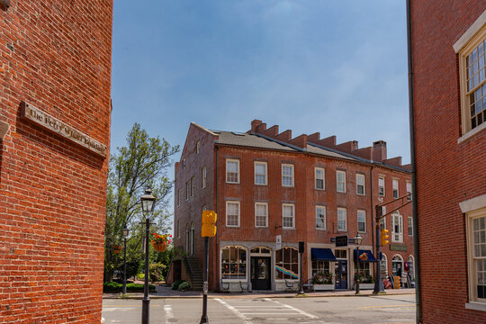 Newburyport, MA, US-June 23, 2025: Street scene in historic downtown of this small town with its quaint streets with 19th century brick buildings and trendy shops and restaurants.