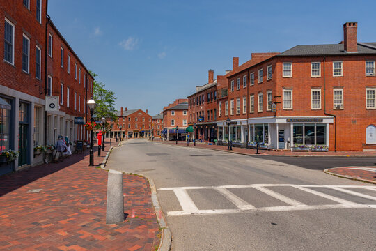 Newburyport, MA, US-June 23, 2025: Street scene in historic downtown of this small town with its quaint streets with 19th century brick buildings and trendy shops and restaurants.