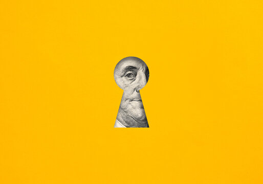 Benjamin Franklin portrait appearing through keyhole on yellow background
