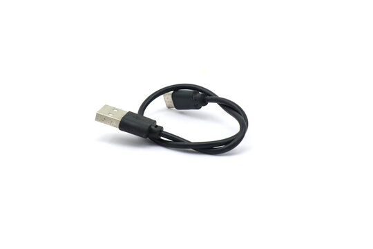 A black USB cable on a white background. A USB cable for data transfer.