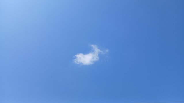 White foamy cloud on pure blue sky, blue sky with clouds.