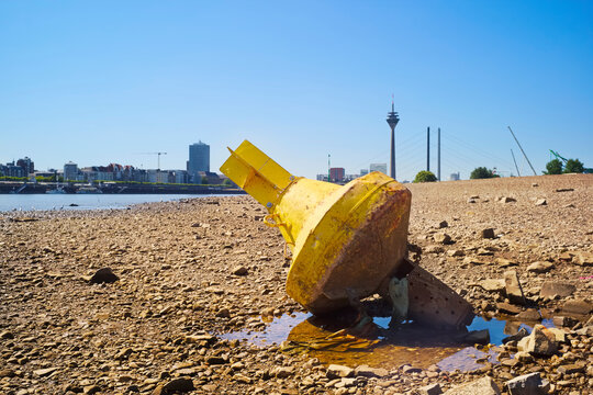 Low stream gauge of river rhine in the town of D&uuml;sseldorf,Germany.Water shortage, drought, climate change,global warming disaster concept.
