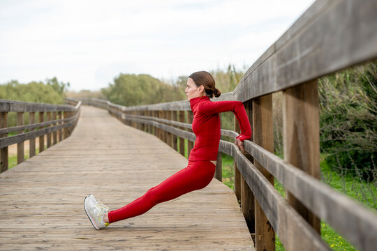 Sporty woman doing tricep dips outdoors