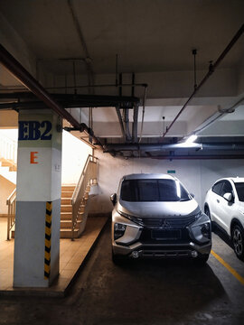Car parking location in the basement parking area with markers on the pillars on June 26, 2026 in Bandung, Indonesia