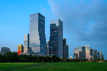 Fototapeta premium modern office building exterior in downtown district in Chengdu under dusk light