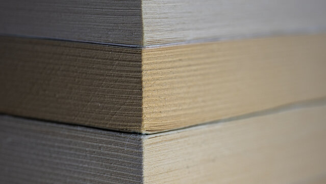 Stacked books showing paper texture and page edges