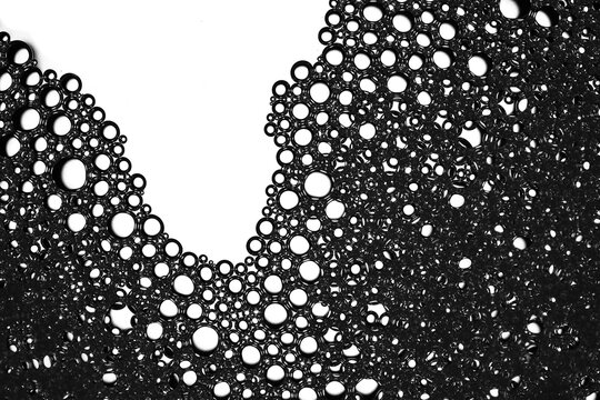 Abstract black bubbles creating a foam texture pattern