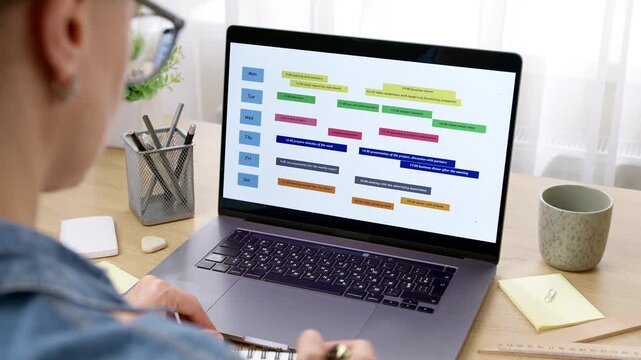 Businesswoman Managing Schedule And Calendar On Laptop For Meeting Planning 4K