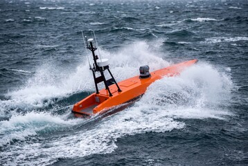 Obraz premium Autonomous surface vehicle navigating rough sea waves with high speed