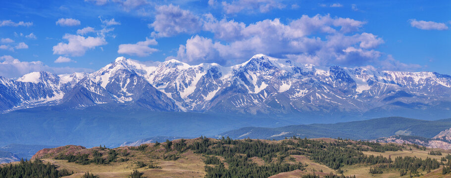 Mountain view, snow-capped mountain peaks, sunny day, summer travels