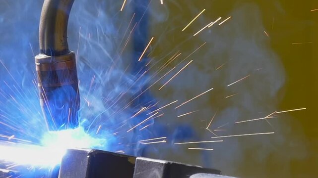 Experience the intricate dance of molten metal as the industrial argon welding robot creates brilliant sparks in a mesmerizing slow motion display. Watch the craftsmanship come alive.