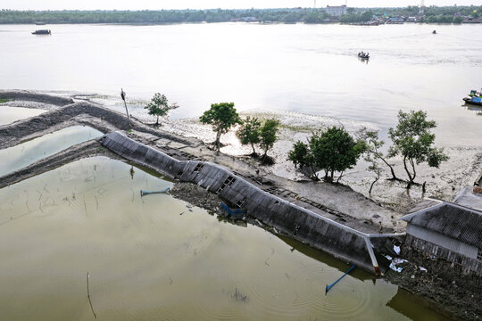 Aerial view of the damaged embankment along the river in the Sundarban mangrove forest area in Satkhira, Khulna Division, Bangladesh.