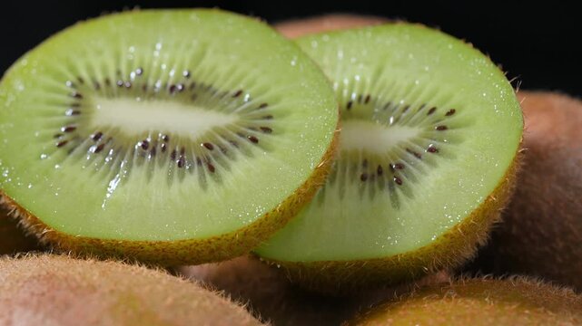 Fresh Kiwi Slices on Plate with Black Background