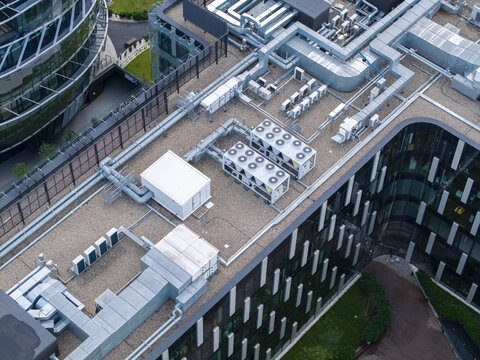 Aerial view of an ai data center rooftop featuring industrial ventilation ducts, cooling systems, and HVAC units in Krakow, Lesser Poland Voivode, Poland.