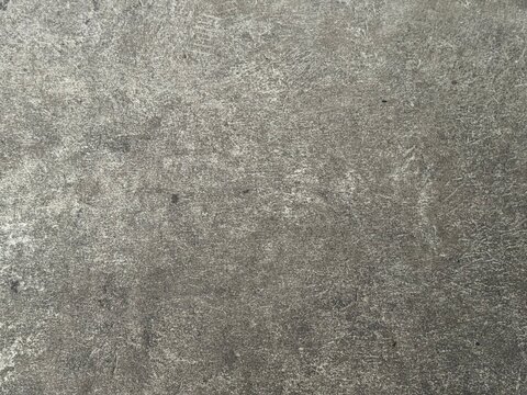 Smooth grey concrete cement wall surface texture background with subtle mottled pattern