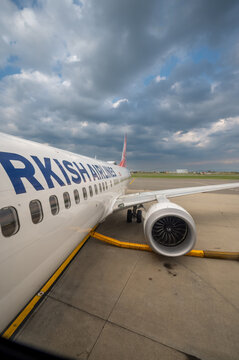 Caselle airport, turin province, italy. August 1, 2025. Turkish airlines aircraft parked on the tarmac at caselle airport, turin, preparing for an upcoming flight under cloudy skies