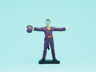 Fototapeta premium Indonesia - November 3, 2025 : Mini toy of action figure at outdoor with blurred background. Miniature photography concept design. Minifigure of Joker character from DC Comics film.