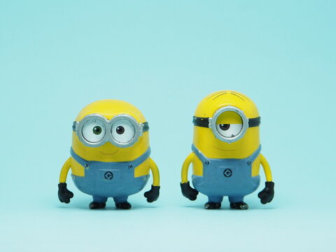 Indonesia - November 3, 2025 : Mini toy of action figure at outdoor with blurred background. Miniature photography concept design. Minions character from Despicable Me Cartoon film.