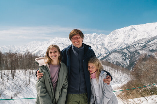 Father with girls are in mountains