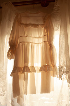 The room with the white dresses in the sunlight 