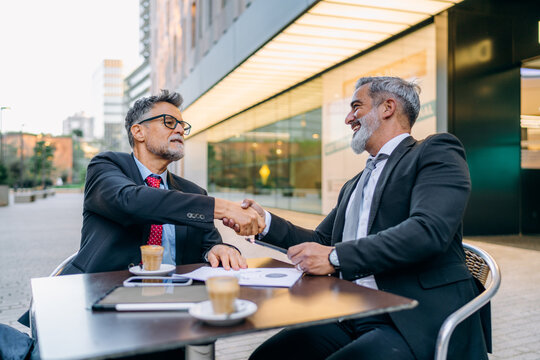 Businessmen shake hands
