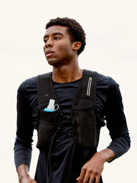 Runner Wearing Hydration Pack During Training Session Outdoors