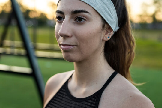 Reflective athlete gazing across outdoor training field