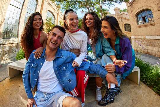 Young people have fun together in a sunny outdoor space
