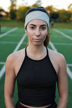 Introspective athlete holding calm on training field