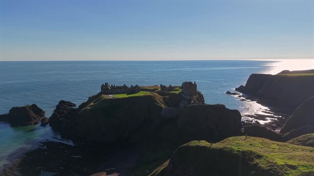 Beautiful cinematic Aerial footage of Dunnottar Castle and Dramatic Cliffs, Stonehaven Scotland &ndash; Historic Medieval Fortress on the North Sea	