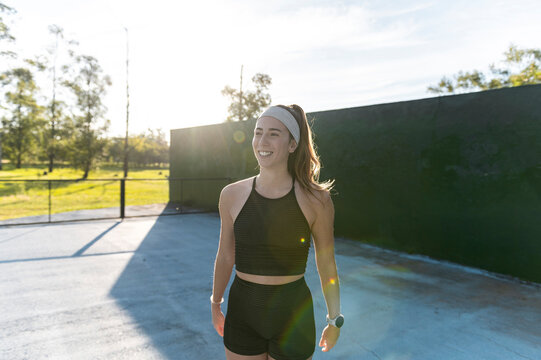 Fit woman walking after outdoor training session
