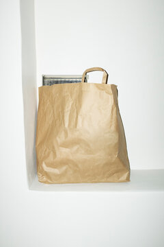 Minimal brown paper mockup bag with empty space for text or design 