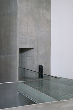 Minimalist Brutalist Interior Architecture with Concrete Wall & Glass
