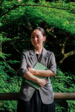 A professional woman analyzing workplace challenges outdoors.