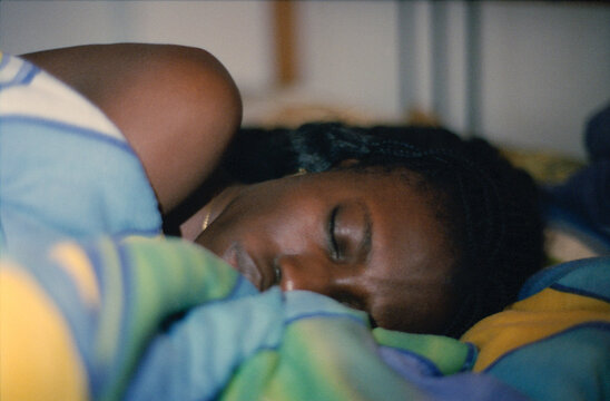 Asleep On Colorful Bedding