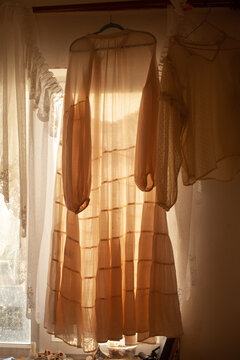 The room with the white dresses in the sunlight 