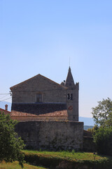 Fototapeta premium Historical architecture and beautiful landscape in the picturesque Mediterranean street in Hum, Croatia. Hum is known as 'smallest town in the world'.