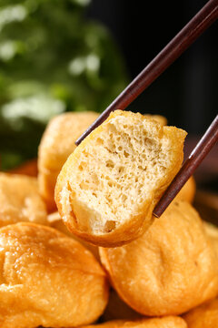 Fried Tofu Puffs with Chopsticks - Golden Crispy Bean Curd Hollow Interior Asian Food