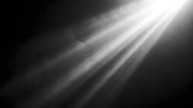 Bright white light beam shining from the corner on a dark black background with soft hazy texture